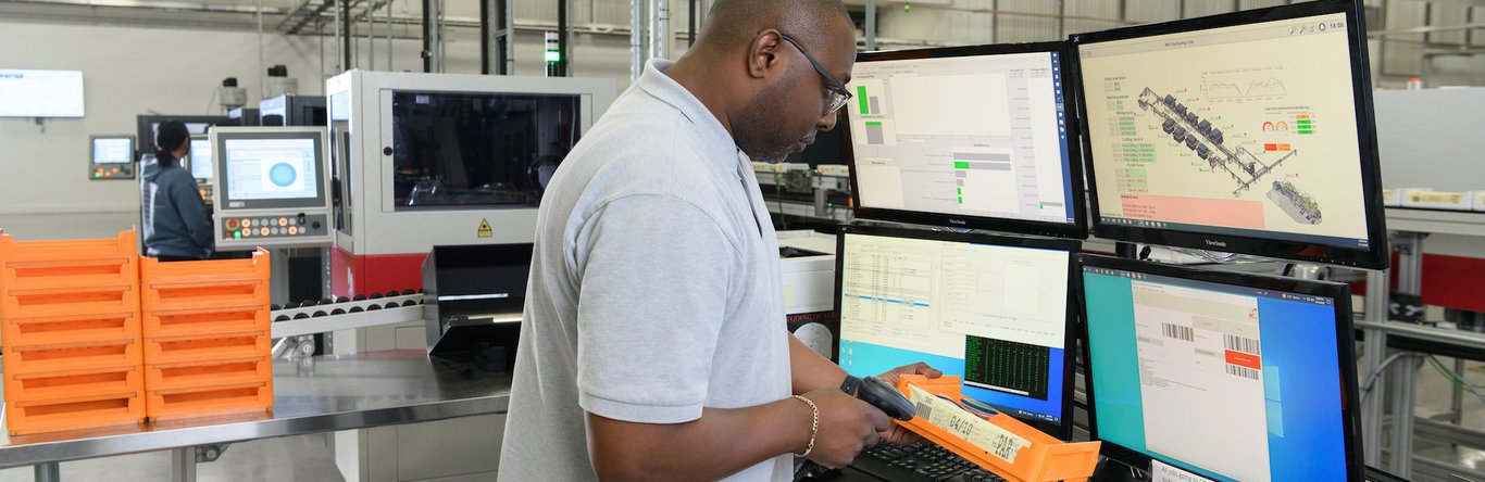 Man at computer scanning an item