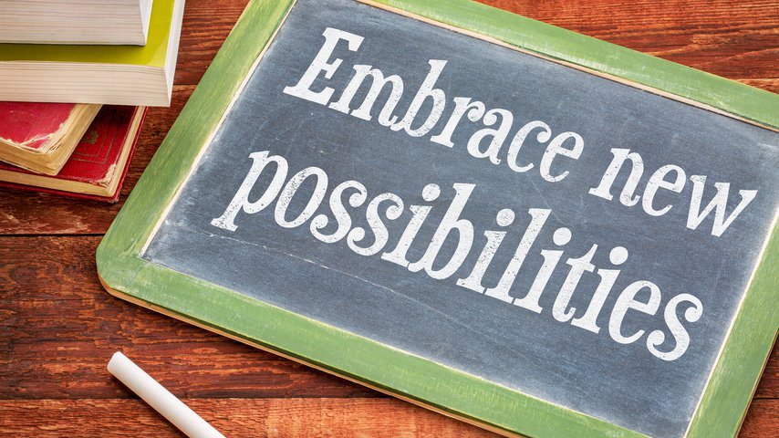 Chalkboard that says Embrace New Possibilities