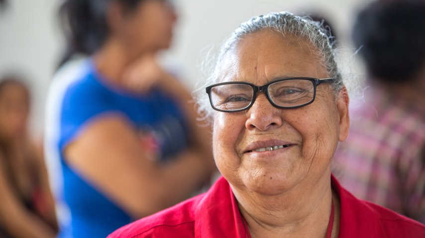Woman wearing glasses while smiling