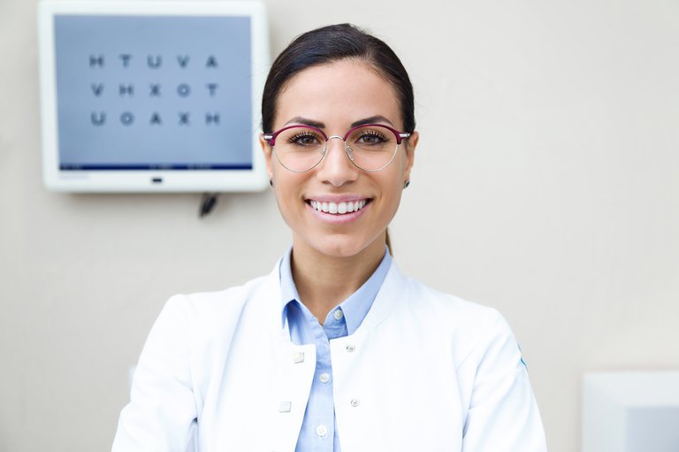 female optometrist smiling