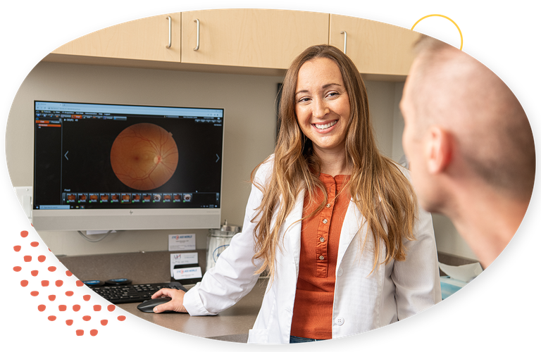 Woman smiling reviewing an image with a patient
