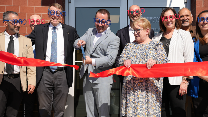 National Vision leadership celebrates the opening of the 1,000th America's Best store, located in Philadelphia.